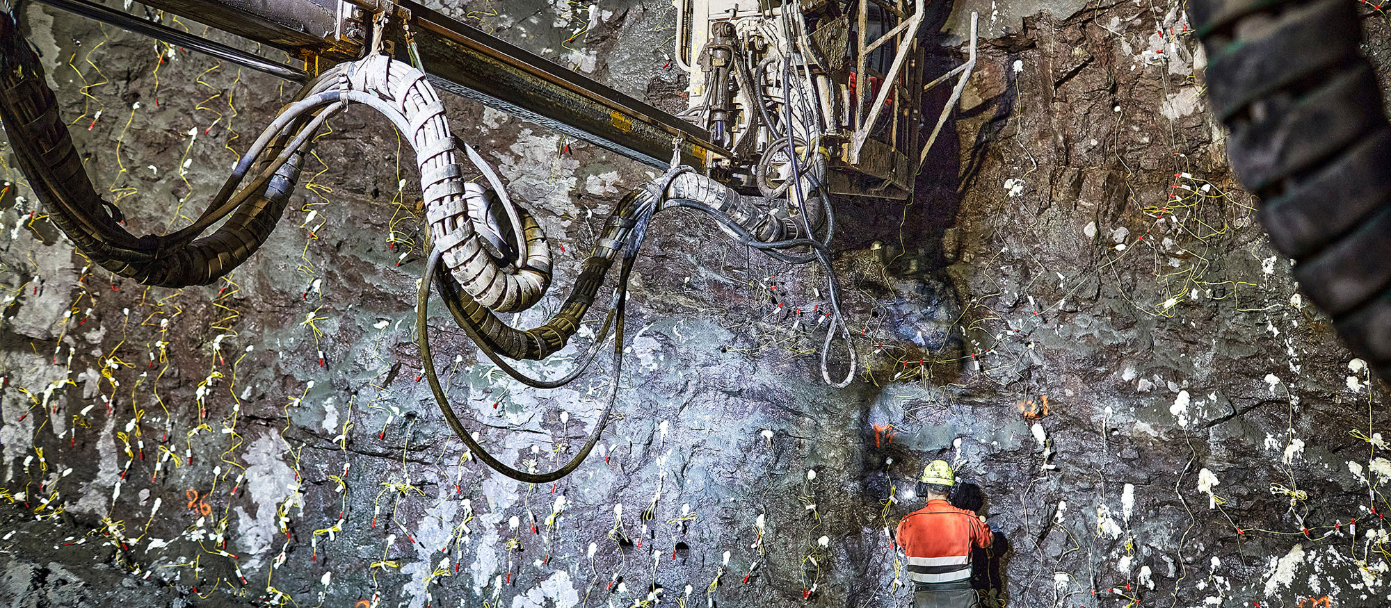 Tunneling. Rig and tunnel workers blow up rocks. Photo.