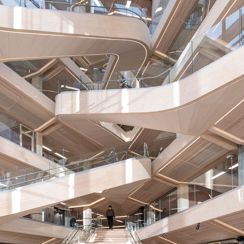 Large wooden stairs indoors. Office building. Photo.